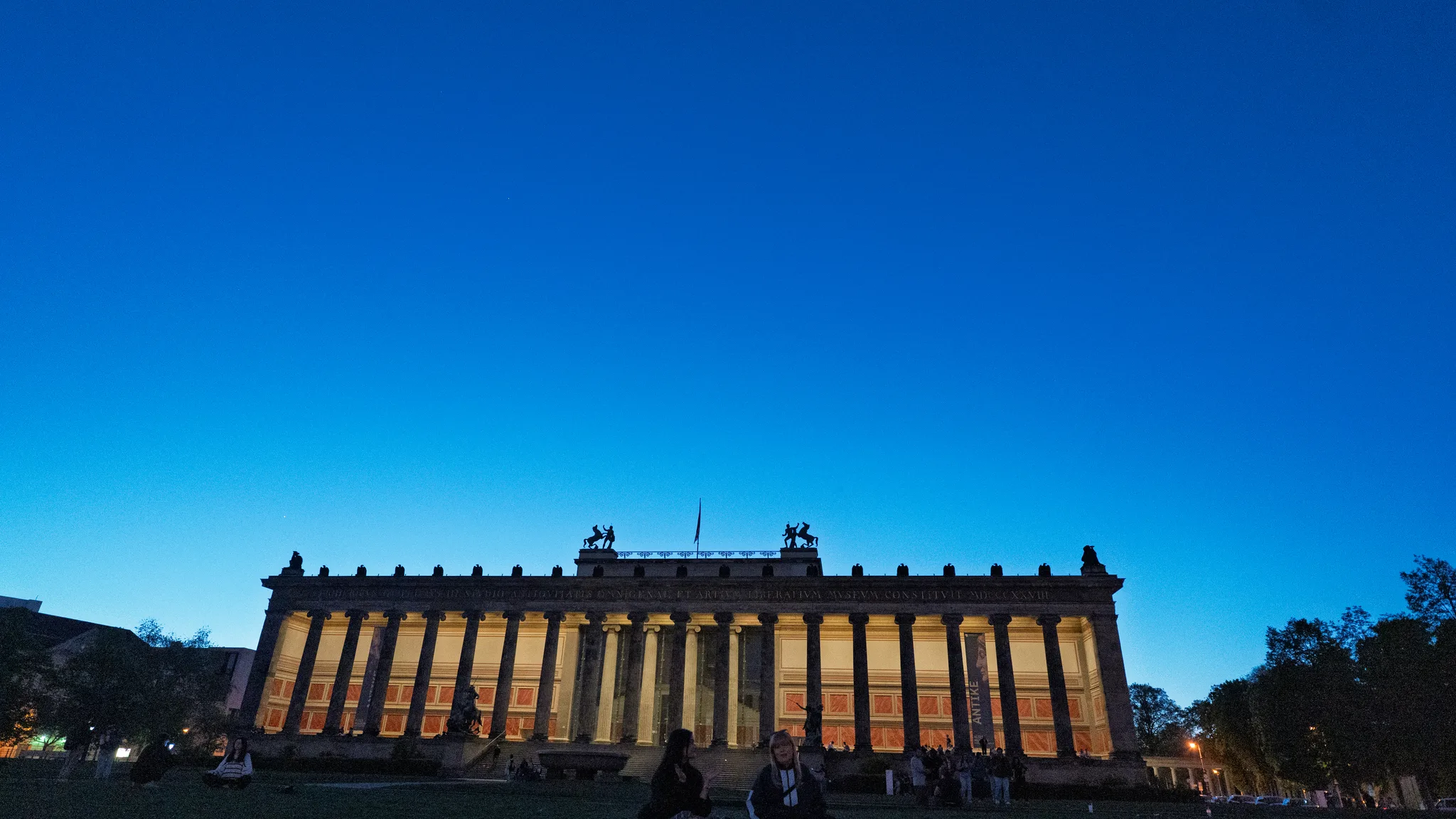The Altes Museum on Museum Island lit up at dusk under a deep blue sky